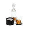 handmade white and black ostrich eggshell patterned round wood coaster set coasters in container with glass and decanter next to it