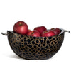 handmade light brown bamboo rings on black serving bowl with black wood interior and silver handles containing red apples
