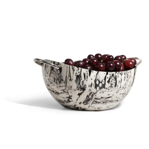 handmade cream and black spotted ojo de pajaro serving bowl with two c-shaped german silver handles and cherries