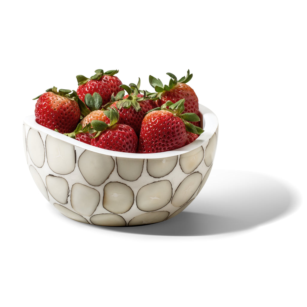 handmade tagua accent bowl with off-white circle pattern filled with red strawberries