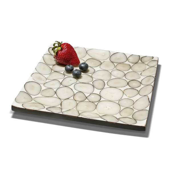 handmade beige and gray tagua seed pattern small platter with one strawberry three blueberries