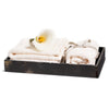 handmade black and beige splatter horn veneer wood bath tray with towels and flower