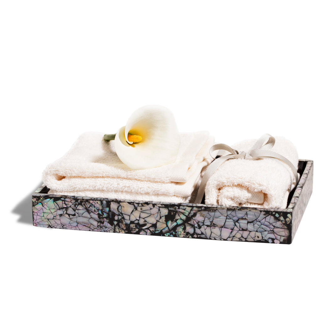 handmade iridescent mother of pearl wood bath tray with towels and flower inside