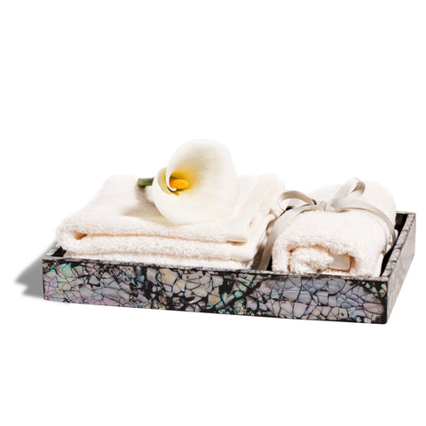 handmade iridescent mother of pearl wood bath tray with towels and flower inside