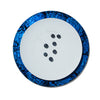 handmade blue mother of pearl iridescent rim of charger plate with white plate and seven blueberries 