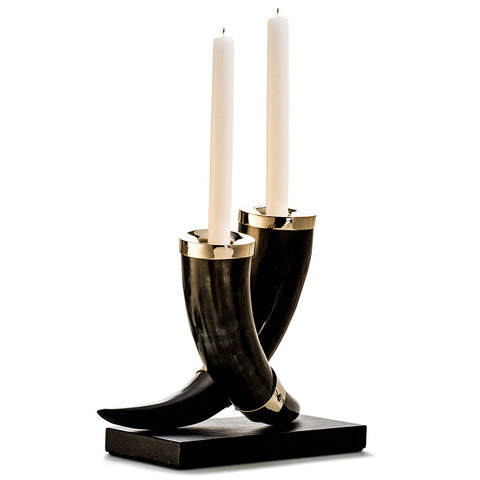 handmade dark natural horn candleholders with german silver accents set on dark brown leather base 