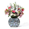 handmade iridescent mother of pearl mosaic on black wood flower vase with flowers inside