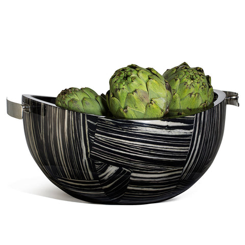 handmade black wood serving bowl with cream geometric stripe pattern and two german silver handles containing artichokes